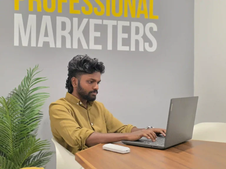 image of top digital marketing expert in kochi working on laptop