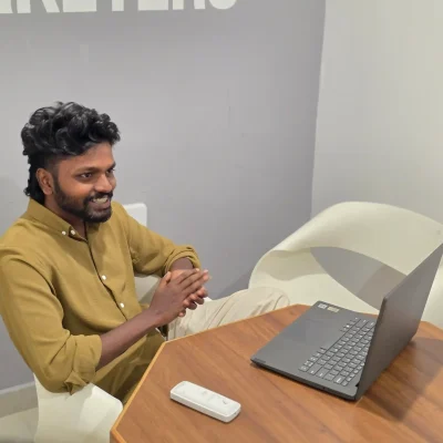 image of best top digital marketer in kochi sitting in front of laptop